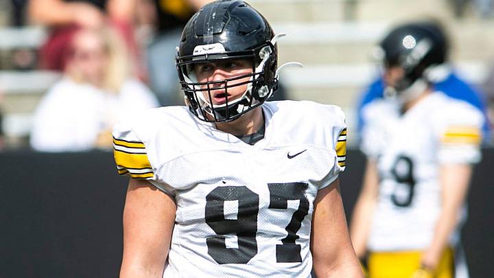 Iowa defensive lineman Caden Crawford (97) listens to instructions between drills during the Hawkeyes' final spring NCAA football practice, Saturday, April 23, 2022, at Kinnick Stadium in Iowa City, Iowa. Iowa defensive lineman Caden Crawford (97) listens to instructions between drills during the Hawkeyes' final spring NCAA football practice, Saturday, April 23, 2022, at Kinnick Stadium in Iowa City, Iowa.