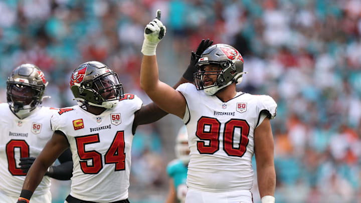 Dec 28, 2025; Miami Gardens, Florida, USA; Tampa Bay Buccaneers defensive end Logan Hall (90) celebrates with linebacker Lavonte David (54) after sacking Miami Dolphins quarterback Quinn Ewers (14, not pictured) during the second quarter at Hard Rock Stadium. Mandatory Credit: Nathan Ray Seebeck-Imagn Images Dec 28, 2025; Miami Gardens, Florida, USA; Tampa Bay Buccaneers defensive end Logan Hall (90) celebrates with linebacker Lavonte David (54) after sacking Miami Dolphins quarterback Quinn Ewers (14, not pictured) during the second quarter at Hard Rock Stadium. Mandatory Credit: Nathan Ray Seebeck-Imagn Images