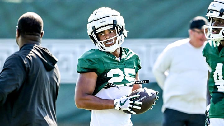 Michigan State's Jace Clarizio, center, listens to coaches after a drill during football practice on Monday, Aug. 11, 2025, in East Lansing. Michigan State's Jace Clarizio, center, listens to coaches after a drill during football practice on Monday, Aug. 11, 2025, in East Lansing.