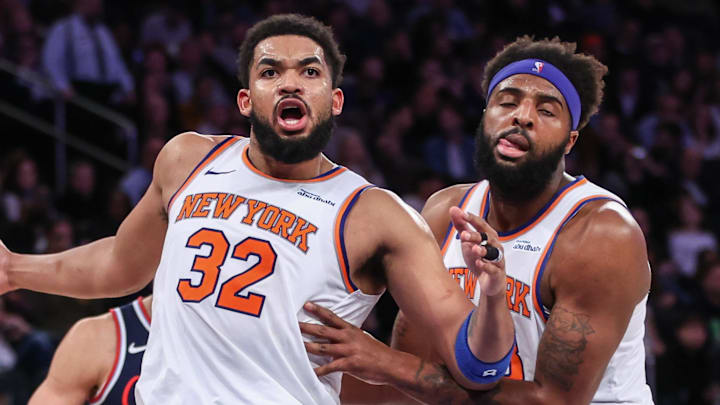 New York Knicks center Karl-Anthony Towns is restrained by center Mitchell Robinson. New York Knicks center Karl-Anthony Towns is restrained by center Mitchell Robinson.