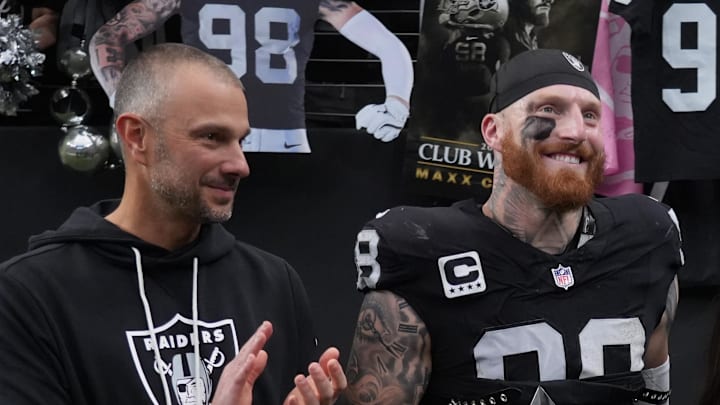 Dec 7, 2025; Paradise, Nevada, USA;  Las Vegas Raiders defensive end Maxx Crosby (98) along with his wife Rachel Washburn and daughter Ella Rose Crosby and Raiders general manager John Spytek receives the Walter Payton Man of the Year Award prior to a game against the Denver Broncos at Allegiant Stadium. Mandatory Credit: Kirby Lee-Imagn Images