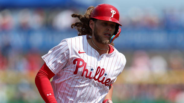 Mar 8, 2025; Clearwater, Florida, USA; Philadelphia Phillies third baseman Alec Bohm (28) runs the bases after hitting a solo home run against the Toronto Blue Jays in the third inning during spring training at BayCare Ballpark.