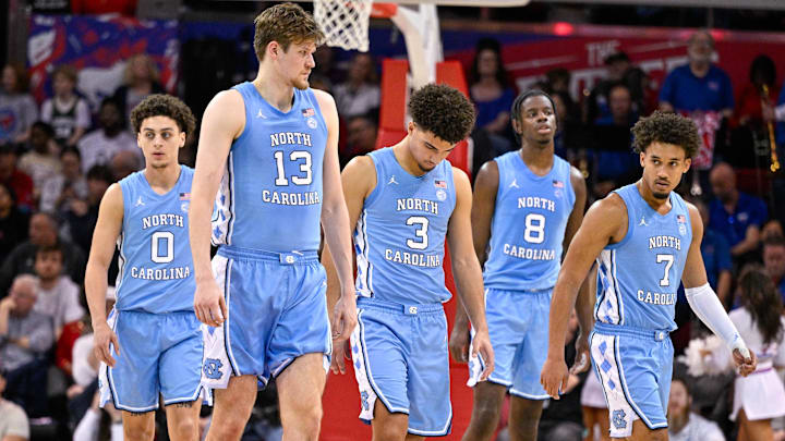 Jan 3, 2026; Dallas, Texas, USA; North Carolina Tar Heels guard Kyan Evans (0) and center Henri Veesaar (13) and guard Derek Dixon (3) and forward Caleb Wilson (8) and guard Seth Trimble (7) come back on the court during the second half against the SMU Mustangs at Moody Coliseum. Mandatory Credit: Jerome Miron-Imagn Images Jan 3, 2026; Dallas, Texas, USA; North Carolina Tar Heels guard Kyan Evans (0) and center Henri Veesaar (13) and guard Derek Dixon (3) and forward Caleb Wilson (8) and guard Seth Trimble (7) come back on the court during the second half against the SMU Mustangs at Moody Coliseum. Mandatory Credit: Jerome Miron-Imagn Images