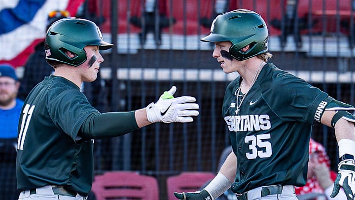 Michigan State infielder Randy Seymour (35) crosses home plate after his eighth-inning home run gave the Spartans a 4–3 lead at Jim Patterson Stadium as Michigan State defeated the Louisville Cardinals in the season opener in Louisville, Ky., on Friday, Feb. 13, 2026.