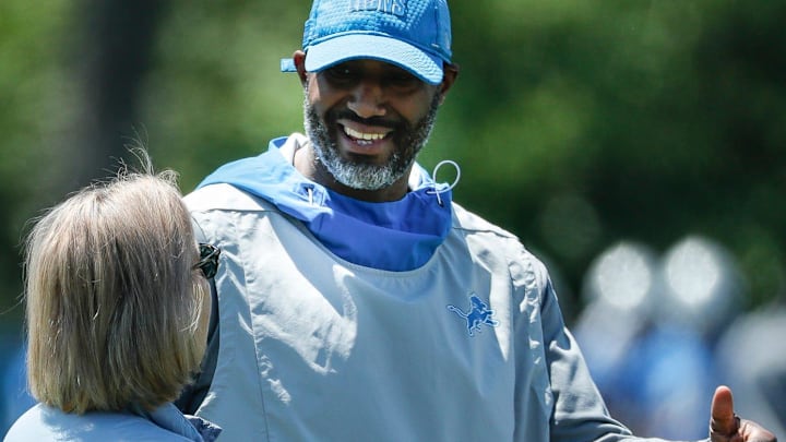 Detroit Lions owner Sheila Ford Hamp talks to general manager Brad Holmes during organized team activities 