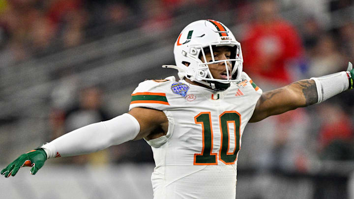 Dec 31, 2025; Arlington, TX, USA; Miami Hurricanes linebacker Raul Aguirre Jr. (10) motions to his teammates during the 2025 Cotton Bowl and quarterfinal game of the College Football Playoff at AT&T Stadium. Mandatory Credit: Jerome Miron-Imagn Images