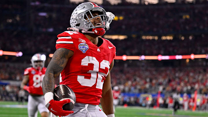 Jan 10, 2025; Arlington, TX, USA; Ohio State Buckeyes running back TreVeyon Henderson (32) celebrates during the game between the Texas Longhorns and the Ohio State Buckeyes at AT&T Stadium. Mandatory Credit: Jerome Miron-Imagn Images
