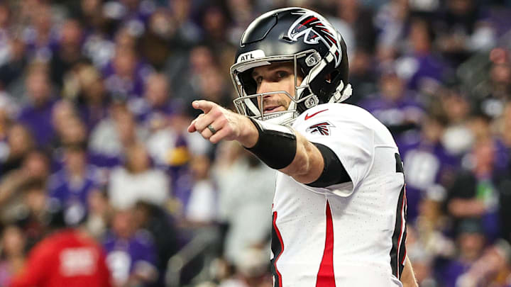 Dec 8, 2024; Minneapolis, Minnesota, USA; Atlanta Falcons quarterback Kirk Cousins (18) celebrates running back Bijan Robinson's (7) touchdown against the Minnesota Vikings during the third quarter at U.S. Bank Stadium. Mandatory Credit: Matt Krohn-Imagn Images