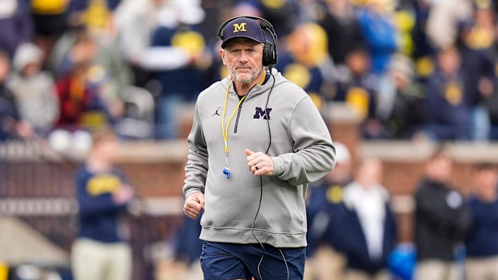 Michigan head coach Kyle Whittingham runs across the field during the spring game at Michigan Stadium in Ann Arbor on Saturday, April 18, 2026.