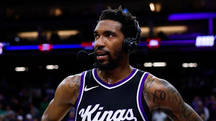 Mar 17, 2025; Sacramento, California, USA; Sacramento Kings guard Malik Monk (0) is interviewed by media after the game against the Memphis Grizzlies at Golden 1 Center. Mandatory Credit: Sergio Estrada-Imagn Images