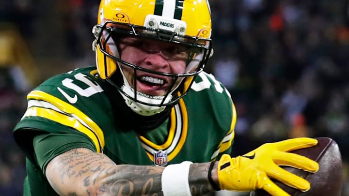 Green Bay Packers wide receiver Christian Watson (9) runs the ball into the end zone for the first touchdown vs. the Bears. Green Bay Packers wide receiver Christian Watson (9) runs the ball into the end zone for the first touchdown vs. the Bears.