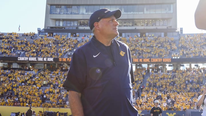 Aug 30, 2025; Morgantown, West Virginia, USA; West Virginia Mountaineers head coach Rich Rodriguez sings “Country Roads” after defeating the Robert Morris Colonials at Milan Puskar Stadium. Mandatory Credit: Ben Queen-Imagn Images