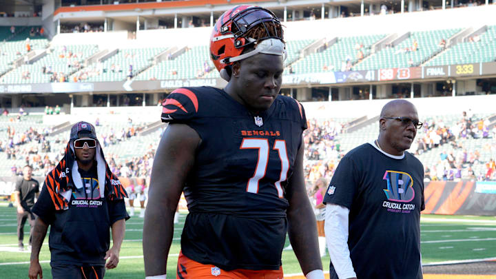 Cincinnati Bengals offensive tackle Amarius Mims (71) walks off the field after a loss to the Baltimore Ravens Sunday October 6, 2024 at Payor Stadium. The Bengals lost 41-38 in overtime.