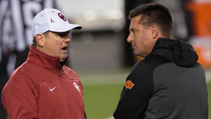 Oklahoma head coach Bob Stoops (left) and Oklahoma State head coach Mike Gundy.