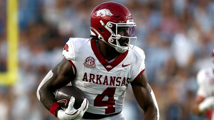 Sep 13, 2025; Oxford, Mississippi, USA; Arkansas Razorback running back Mike Washington Jr. (4) runs the ball for a touchdown during the second quarter against the Mississippi Rebels at Vaught-Hemingway Stadium. Mandatory Credit: Petre Thomas-Imagn Images