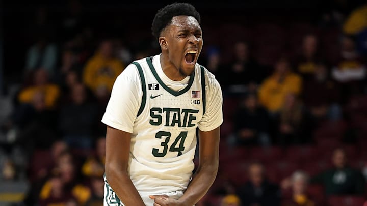 Dec 4, 2024; Minneapolis, Minnesota, USA; Michigan State Spartans forward Xavier Booker (34) celebrates his three-point basket against the Minnesota Golden Gophers during the second half at Williams Arena. Mandatory Credit: Matt Krohn-Imagn Images