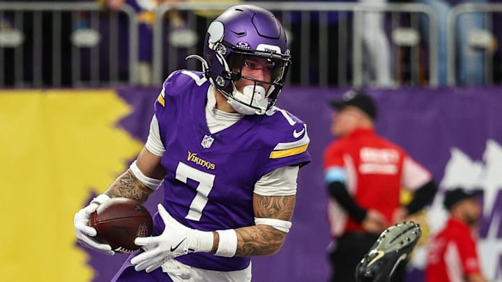 Dec 8, 2024; Minneapolis, Minnesota, USA; Minnesota Vikings cornerback Byron Murphy Jr. (7) intercepts a pass intended for Atlanta Falcons tight end Kyle Pitts (8) during the fourth quarter at U.S. Bank Stadium. Mandatory Credit: Matt Krohn-Imagn Images