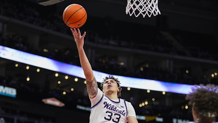 Dec 17, 2024; Kansas City, Missouri, USA; Kansas State Wildcats guard Coleman Hawkins (33) shoots during the first half against the Drake Bulldogs at T-Mobile Center. Mandatory Credit: Jay Biggerstaff-Imagn Images