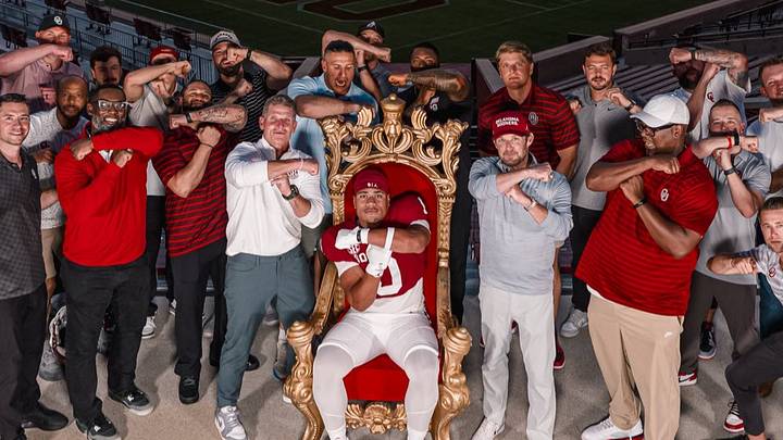 Oklahoma edge rusher prospect Uhila Wolfgramm poses for a photo with the Sooners' coaching staff on his official visit. Oklahoma edge rusher prospect Uhila Wolfgramm poses for a photo with the Sooners' coaching staff on his official visit.
