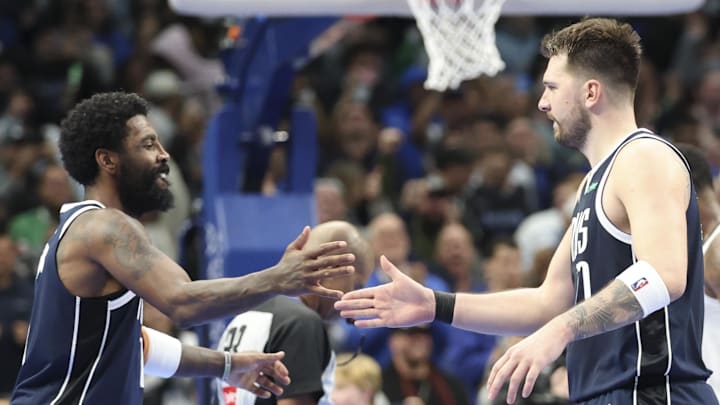 Dec 3, 2024; Dallas, Texas, USA; Dallas Mavericks guard Kyrie Irving (11) celebrates with Dallas Mavericks guard Luka Doncic (77) during the fourth quarter against the Memphis Grizzlies at American Airlines Center. Mandatory Credit: Kevin Jairaj-Imagn Imagesv Dec 3, 2024; Dallas, Texas, USA; Dallas Mavericks guard Kyrie Irving (11) celebrates with Dallas Mavericks guard Luka Doncic (77) during the fourth quarter against the Memphis Grizzlies at American Airlines Center. Mandatory Credit: Kevin Jairaj-Imagn Imagesv