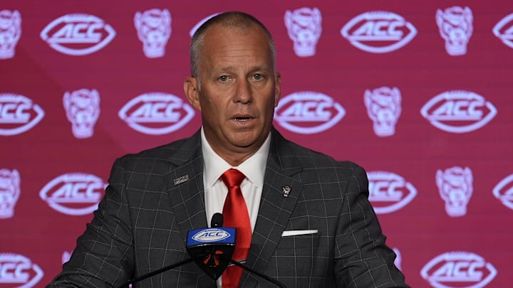 Jul 25, 2024; Charlotte, NC, USA;  North Carolina State Wolfpack head coach Dave Doeren speaks to the media during the ACC Kickoff at Hilton Charlotte Uptown. Mandatory Credit: Jim Dedmon-Imagn Images