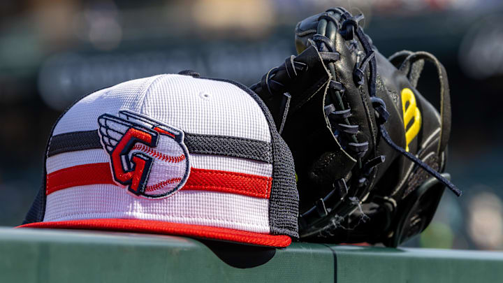 Jul 8, 2024; Detroit, Michigan, USA; A Cleveland Guardians baseball cap and glove sit on the dugout rail before the game against the Detroit Tigers at Comerica Park. Mandatory Credit: David Reginek-Imagn Images Jul 8, 2024; Detroit, Michigan, USA; A Cleveland Guardians baseball cap and glove sit on the dugout rail before the game against the Detroit Tigers at Comerica Park. Mandatory Credit: David Reginek-Imagn Images