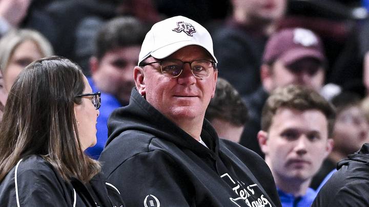 Texas A&M Aggies head football coach Mike Elko sits courtside during the Men’s basketball game against the Florida Gators Texas A&M Aggies head football coach Mike Elko sits courtside during the Men’s basketball game against the Florida Gators