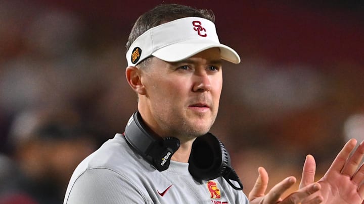 Oct 1, 2022; Los Angeles, California, USA;  USC Trojans head coach Lincoln Riley applauds after a touchdown in the first half against the Arizona State Sun Devils at United Airlines Field at the Los Angeles Memorial Coliseum. Mandatory Credit: Jayne Kamin-Oncea-Imagn Images