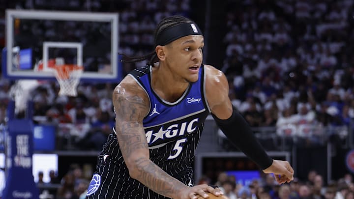 Apr 22, 2026; Detroit, Michigan, USA; Orlando Magic forward Paolo Banchero (5) dribbles defended by Detroit Pistons guard Kevin Huerter (27) in the first half during game two of the first round of the 2026 NBA Playoffs at Little Caesars Arena. Mandatory Credit: Rick Osentoski-Imagn Images