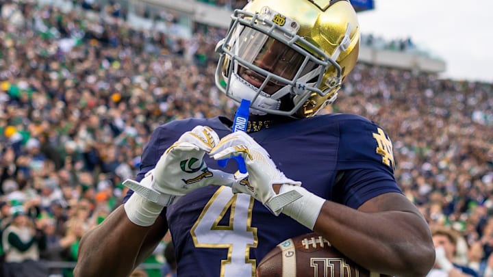 Nov 22, 2025; South Bend, Indiana, USA; Notre Dame Fighting Irish running back Jeremiyah Love (4) celebrates scoring against the Syracuse Orange during the first half at Notre Dame Stadium. Mandatory Credit: Michael Caterina-Imagn Images