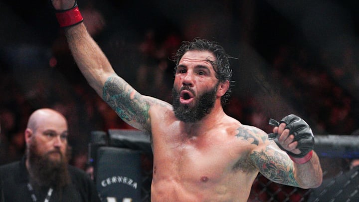 Dec 2, 2023; Austin, Texas, USA; Clay Guida (red gloves) fights Joaquim Silva (blue gloves) during UFC Fight Night at Moody Center. Mandatory Credit: Dustin Safranek-Imagn Images