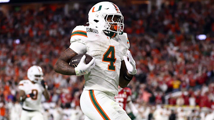 Jan 19, 2026; Miami Gardens, FL, USA; Miami Hurricanes running back Mark Fletcher Jr. (4) rushes for touchdown against the Indiana Hoosiers in the second half during the College Football Playoff National Championship game at Hard Rock Stadium. Mandatory Credit: Mark J. Rebilas-Imagn Images