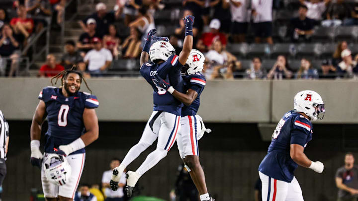 Sep 12, 2025; Tucson, Arizona, USA; Arizona Wildcats defensive back Jay’Vion Cole (8) celebrates with teammate during the third quarter of the game against the Kansas State Wildcats at Arizona Stadium. Mandatory Credit: Aryanna Frank-Imagn Images
