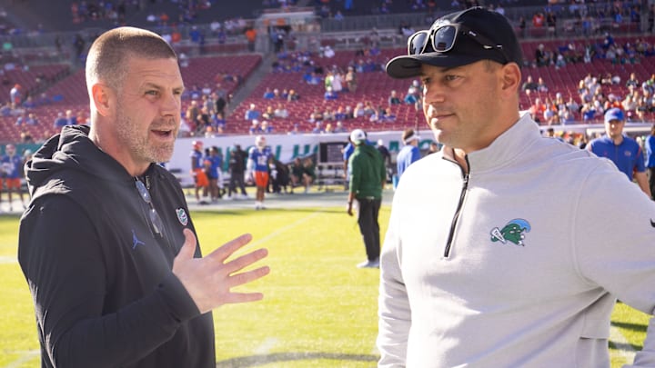 New Florida Gators head coach Jon Sumrall (right) replaced Billy Napier.