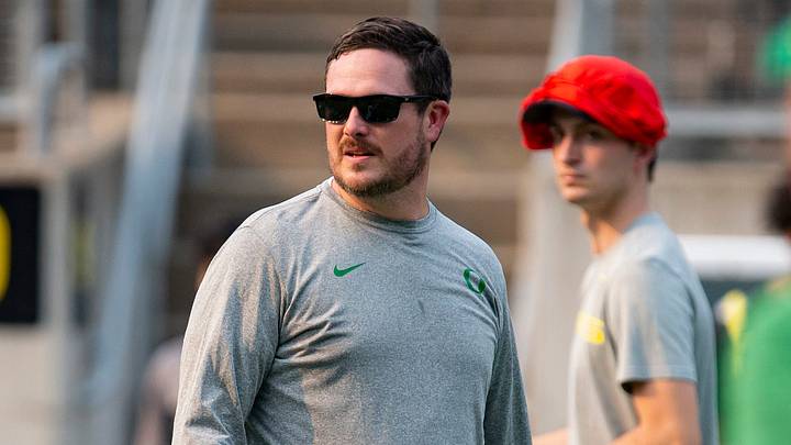 Oregon head coach Dan Lanning surveys drills during a \"Saturday Night Live\" event to host youth football players at Autzen Stadium Saturday, July 30, 2022.

PRINT MAIN 073022 Eug Snl 1