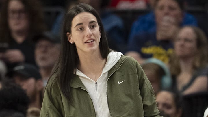 Aug 24, 2025; Minneapolis, Minnesota, USA; Indiana Fever guard Caitlin Clark (22) looks on from the bench against the Minnesota Lynx in the second half at Target Center. Mandatory Credit: Jesse Johnson-Imagn Images