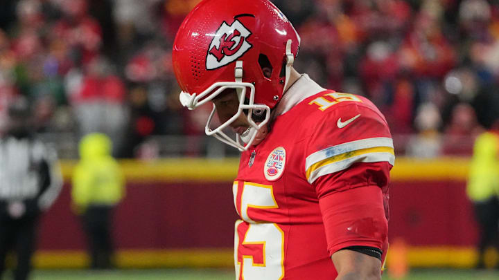 Dec 7, 2025; Kansas City, Missouri, USA; Kansas City Chiefs quarterback Patrick Mahomes (15) lowers his head during the fourth quarter against the Houston Texans at GEHA Field at Arrowhead Stadium.