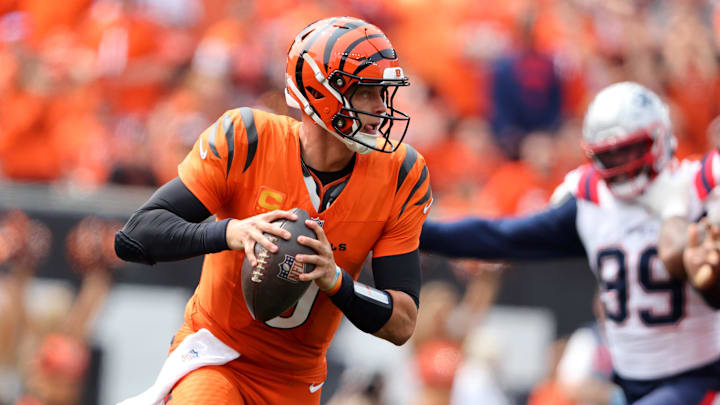 Sep 8, 2024; Cincinnati, Ohio, USA;  Cincinnati Bengals quarterback Joe Burrow (9) runs the ball during the first quarter against the New England Patriots at Paycor Stadium. Mandatory Credit: Joseph Maiorana-Imagn Images