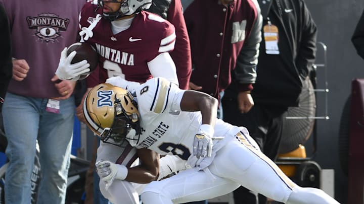 Nov 22, 2025; Missoula, MT, USA; Montana Grizzlies wide receiver Michael Wortham (6) is pushed out of bounds by Montana State Bobcats defensive back Carson Williams (8) during the first half at Washington-Grizzly Stadium.
