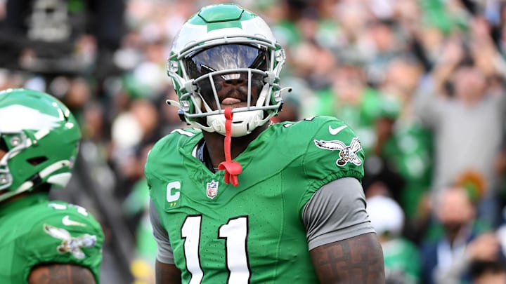 Dec 29, 2024; Philadelphia, Pennsylvania, USA; Philadelphia Eagles wide receiver A.J. Brown (11) throws the football into the stands after scoring a touchdown  during the third quarter against the Dallas Cowboys at Lincoln Financial Field. Mandatory Credit: Eric Hartline-Imagn Images