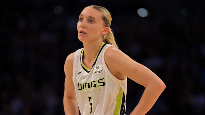 Sep 7, 2025; Los Angeles, California, USA;  Dallas Wings guard Paige Bueckers (5) looks on during the first half against the Los Angeles Sparks at Crypto.com Arena. Mandatory Credit: Jayne Kamin-Oncea-Imagn Images