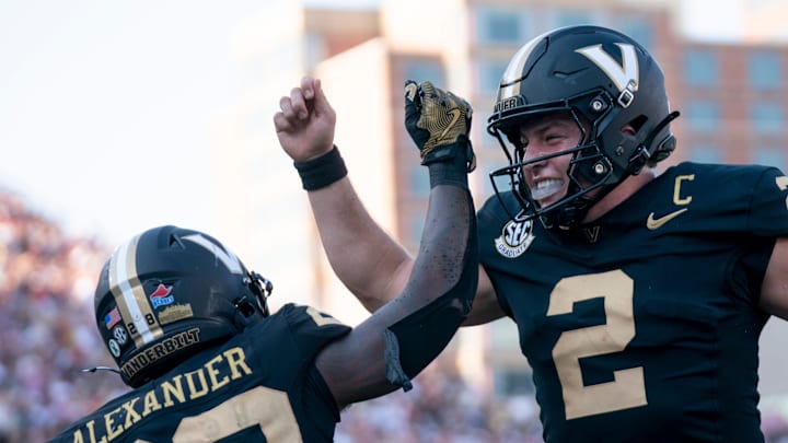 Vanderbilt running back Sedrick Alexander (28) and quarterback Diego Pavia (2) celebrate a touchdown against Alabama in Nashville on Oct. 5, 2024. The Commodores went on to pull off the upset agains the No. 1 Crimson Tide, with fans subsequently storming the the field and tearing down the goalposts in celebration. 