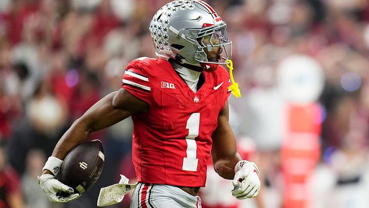Ohio State Buckeyes CB Davison Igbinosun celebrates an interception against the Indiana Hoosiers at Lucas Oil Stadium.