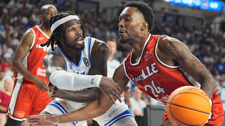 La Familia’s Chris Coffey tries to stop The Ville’s Jae Withers in first game of The Basketball Tournament at Memorial Coliseum.
July 18, 2026 La Familia’s Chris Coffey tries to stop The Ville’s Jae Withers in first game of The Basketball Tournament at Memorial Coliseum.
July 18, 2026