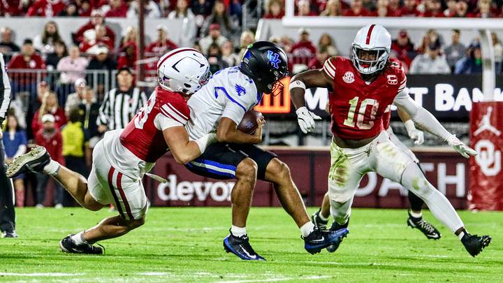 Oklahoma defensive end Jake Kreul and linebacker Kip Lewis combine for a sack against Kentucky. Oklahoma defensive end Jake Kreul and linebacker Kip Lewis combine for a sack against Kentucky.