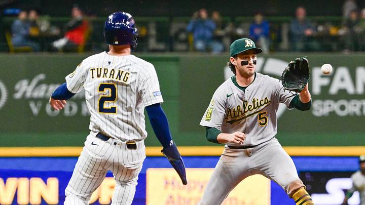 Apr 19, 2025; Milwaukee, Wisconsin, USA; Athletics shortstop Jacob Wilson (5) forces out Milwaukee Brewers second baseman Brice Turang (2) in the sixth inning at American Family Field. Mandatory Credit: Benny Sieu-Imagn Images Apr 19, 2025; Milwaukee, Wisconsin, USA; Athletics shortstop Jacob Wilson (5) forces out Milwaukee Brewers second baseman Brice Turang (2) in the sixth inning at American Family Field. Mandatory Credit: Benny Sieu-Imagn Images