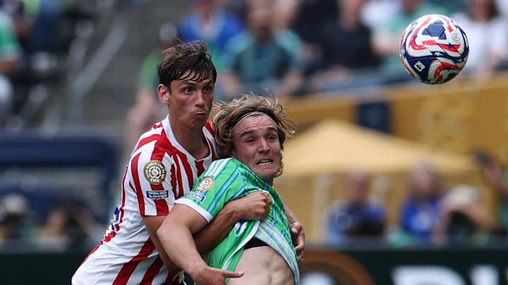 [Subscription Customers Only] Jun 19, 2025; Seattle, Washington, USA; Seattle Sounders FC's Pedro de la Vega in action with Atletico Madrid's Robin Le Normand during a group stage match of the 2025 FIFA Club World Cup at Lumen Field. Mandatory Credit: Agustin Marcarian-Reuters via Imagn Images