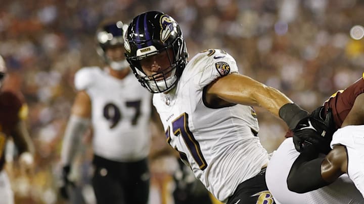 Aug 21, 2023; Landover, Maryland, USA; Washington Commanders running back Antonio Gibson (24) catches a touchdown pass as Baltimore Ravens cornerback Jeremy Lucien (31) and Ravens linebacker Josh Ross (51) defend during the second quarter at FedExField. Mandatory Credit: Geoff Burke-Imagn Images Aug 21, 2023; Landover, Maryland, USA; Washington Commanders running back Antonio Gibson (24) catches a touchdown pass as Baltimore Ravens cornerback Jeremy Lucien (31) and Ravens linebacker Josh Ross (51) defend during the second quarter at FedExField. Mandatory Credit: Geoff Burke-Imagn Images