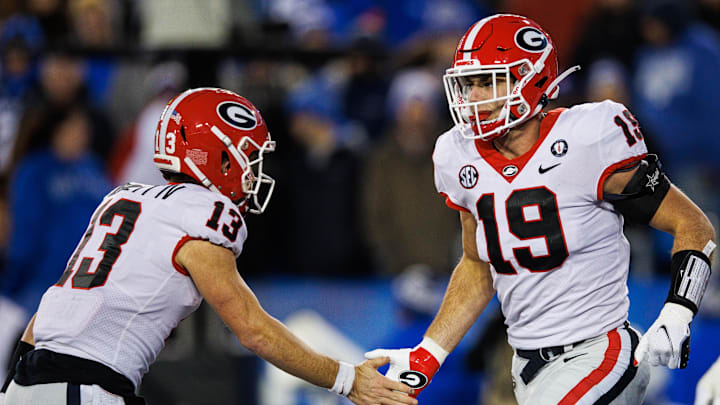 Nov 19, 2022; Lexington, Kentucky, USA; Georgia Bulldogs tight end Brock Bowers (19) celebrates with quarterback Stetson Bennett (13) during the third quarter against the Kentucky Wildcats at Kroger Field. Mandatory Credit: Jordan Prather-Imagn Images Nov 19, 2022; Lexington, Kentucky, USA; Georgia Bulldogs tight end Brock Bowers (19) celebrates with quarterback Stetson Bennett (13) during the third quarter against the Kentucky Wildcats at Kroger Field. Mandatory Credit: Jordan Prather-Imagn Images