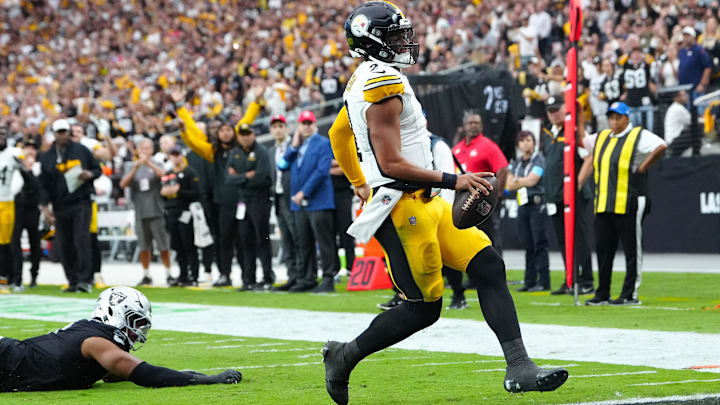 Oct 13, 2024; Paradise, Nevada, USA; Pittsburgh Steelers quarterback Justin Fields (2) scores a rushing touchdown against the Las Vegas Raiders during the second quarter at Allegiant Stadium. Mandatory Credit: Stephen R. Sylvanie-Imagn Images